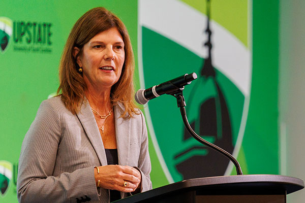 Speaker talking from a podium at a past event